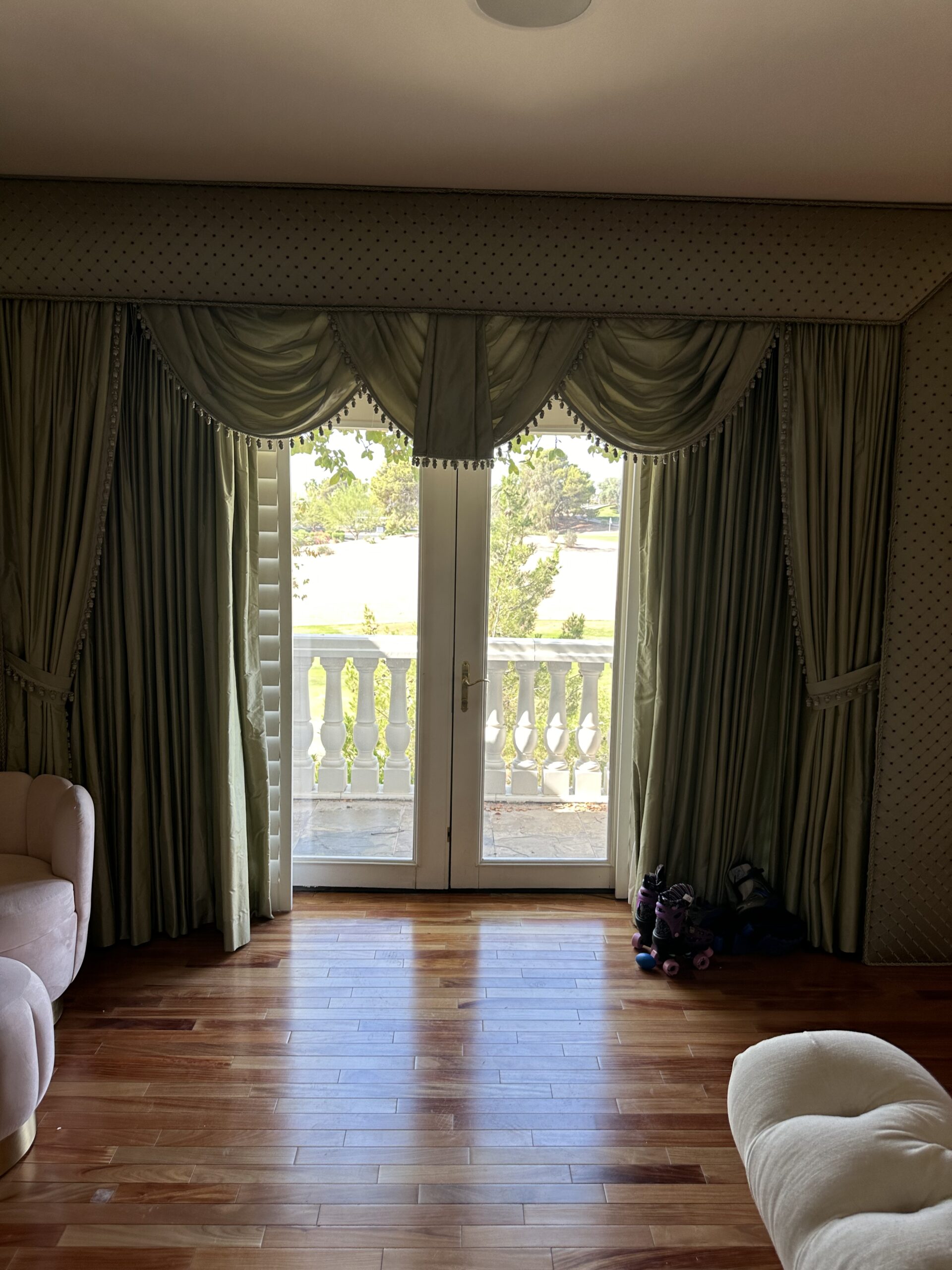 bedroom doors to the balcony overlooking the pool and golf course